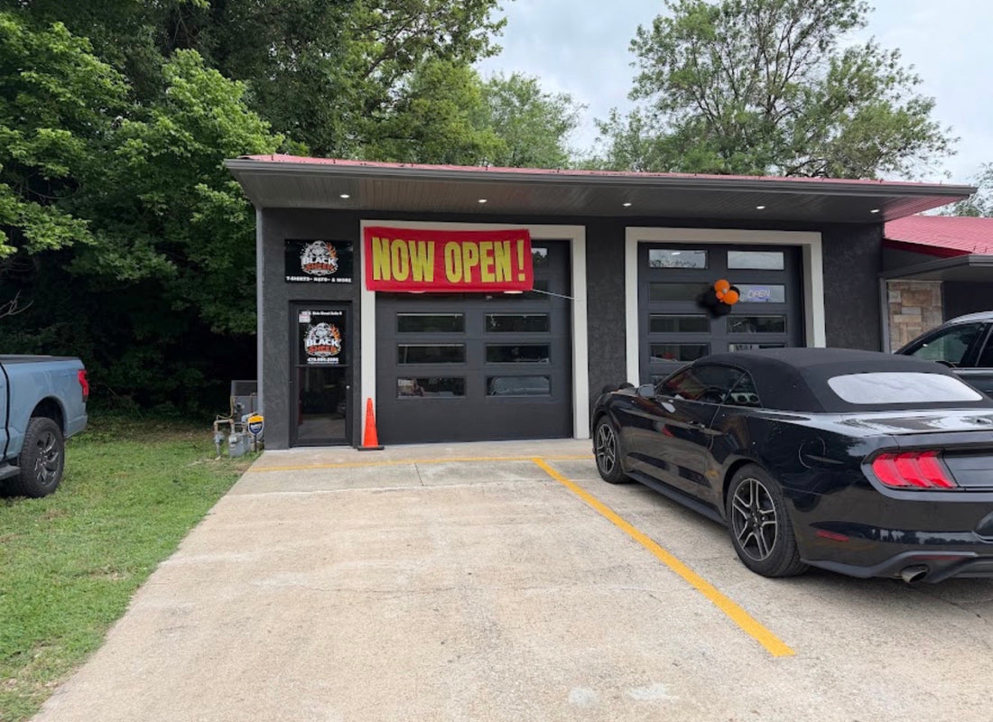 Black Sheep Custom Design storefront in Cave Springs, Arkansas, with the shop entrance and Now Open banner.