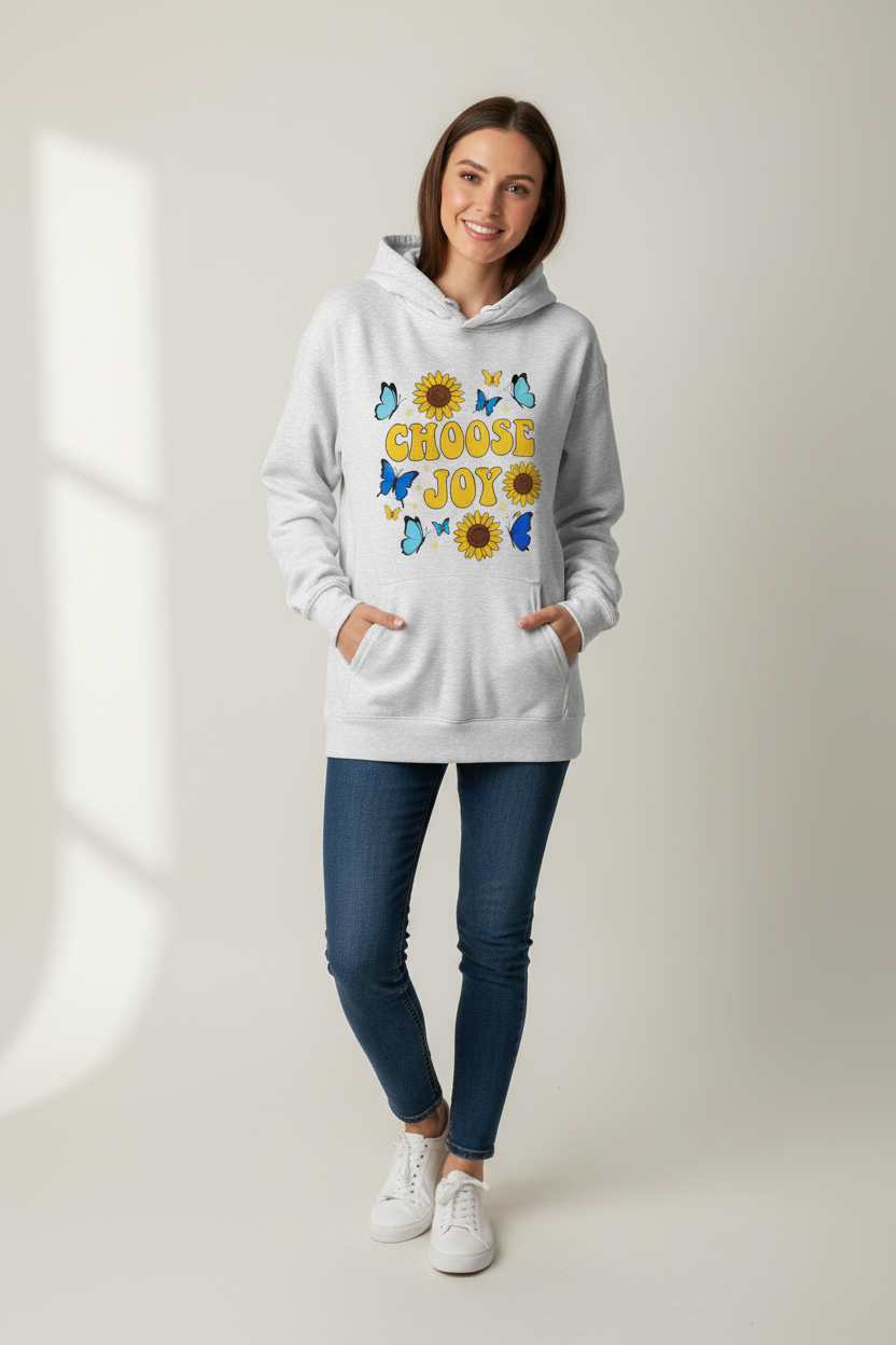 Person wearing CHOOSE JOY hoodie with sunflowers and butterflies