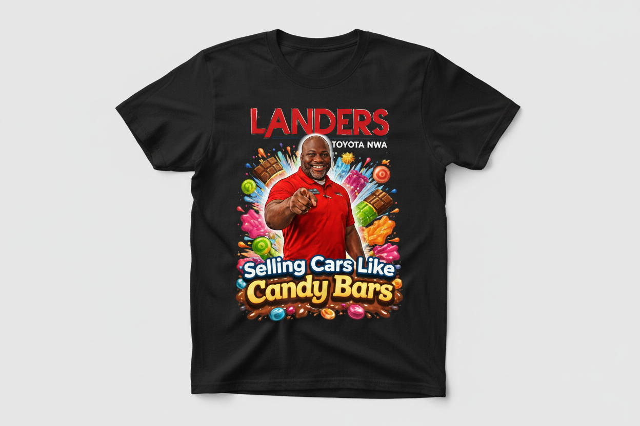 Landers Toyota NWA t-shirt with colorful candy-themed design and "Selling Cars Like Candy Bars" slogan featuring a smiling salesperson